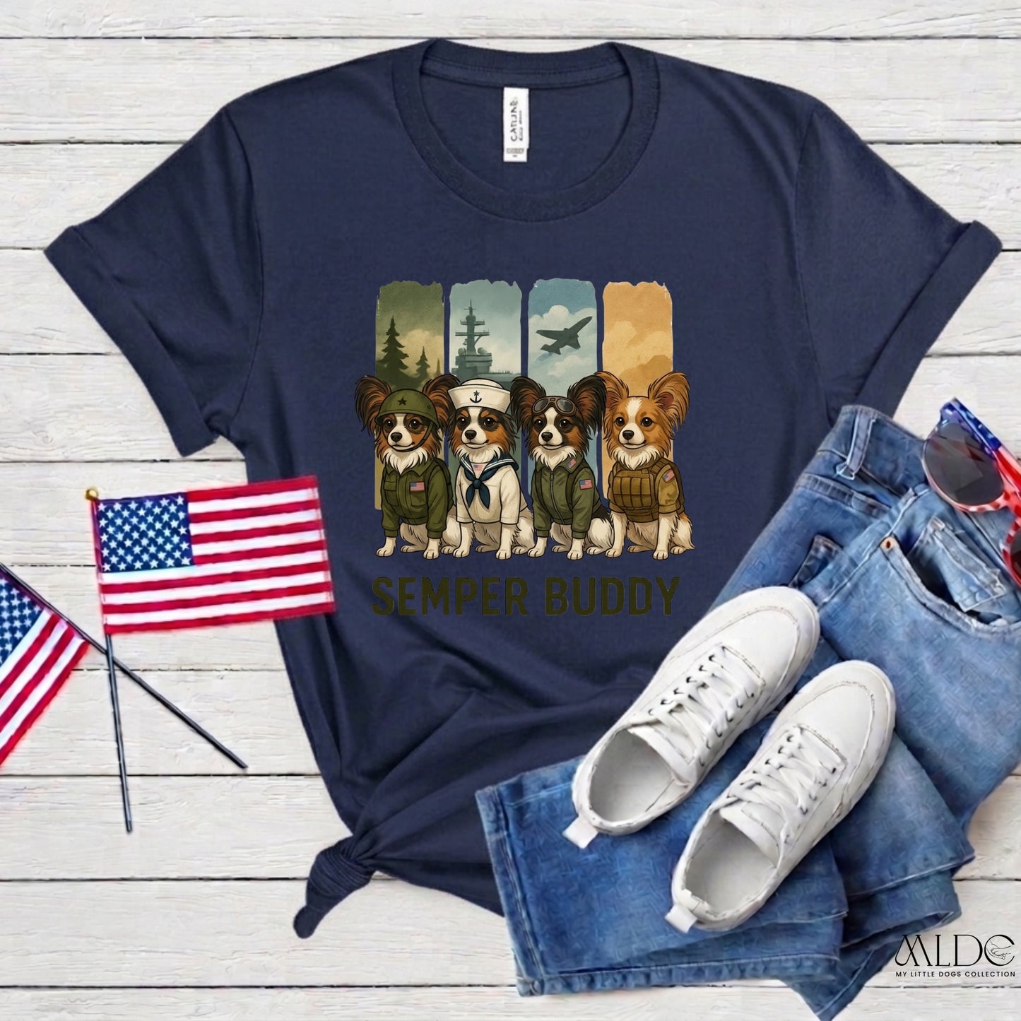 Navy blue t-shirt with dog graphic and 'Semper Buddy' text, paired with jeans and sneakers on a wooden surface.