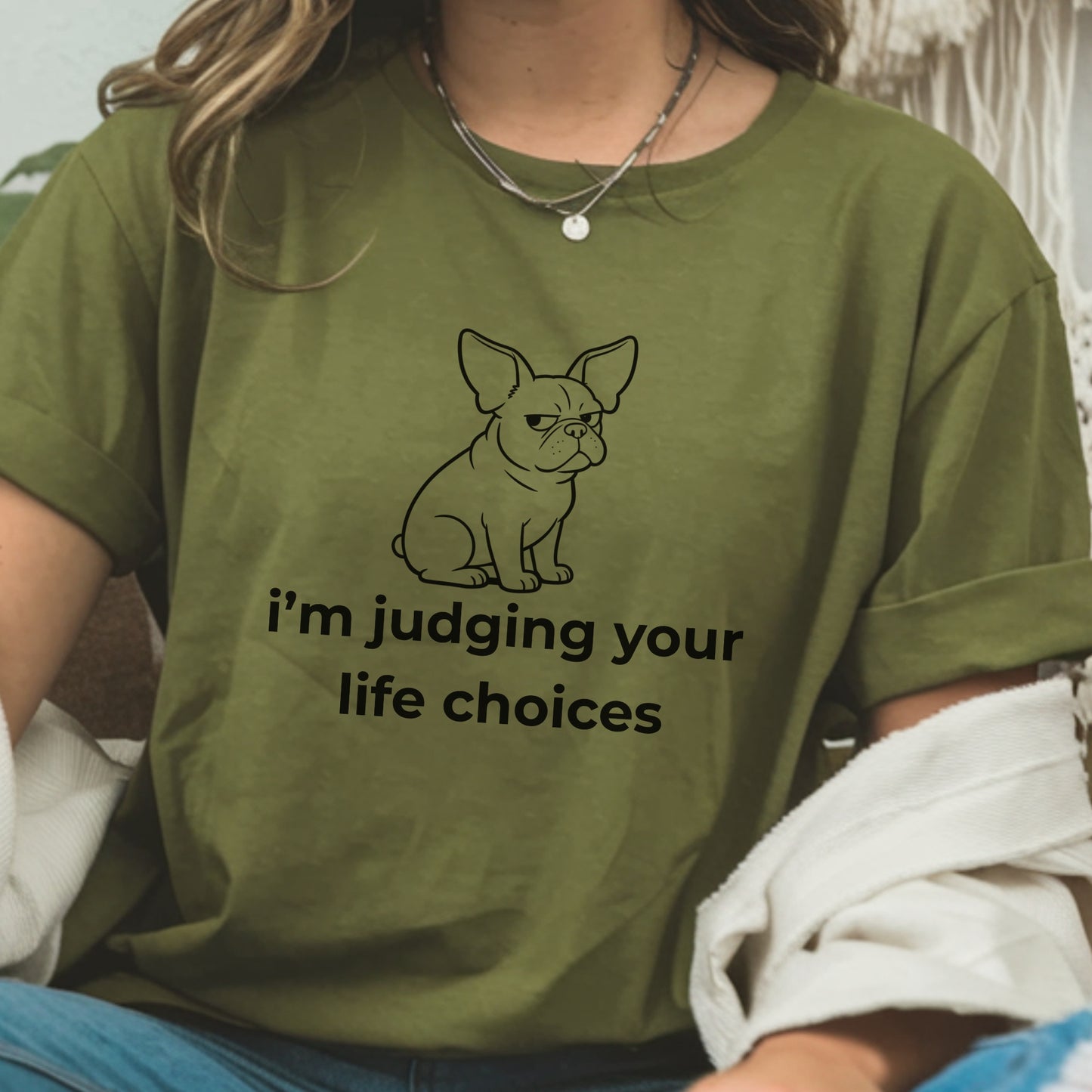 Person wearing a green t-shirt with a dog graphic and text.