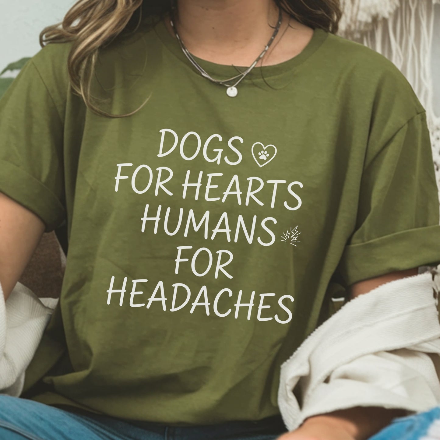 Person wearing a green t-shirt with a humorous text design.