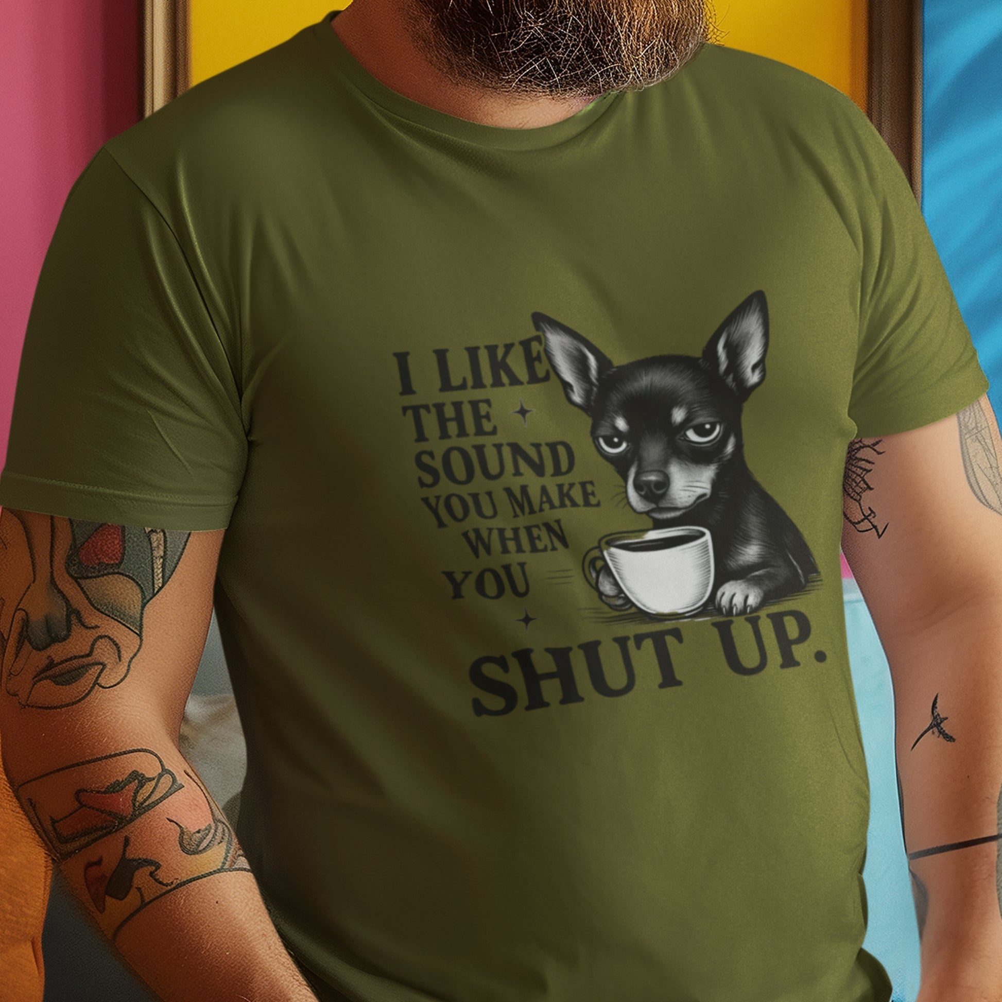 Man wearing an olive "I Like The Sound You Make When You Shut Up" Mini Pinscher unisex t-shirt holding coffee
