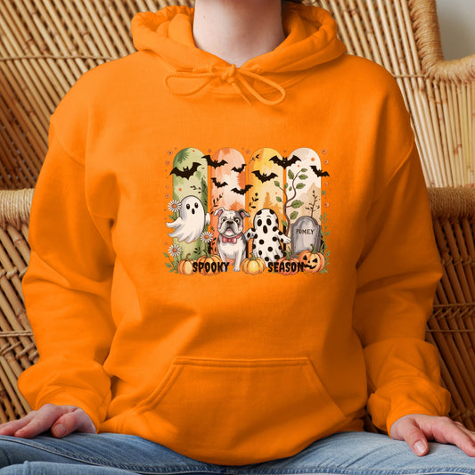 Orange hoodie with Halloween-themed print of small dogs in ghost costumes, bats, pumpkins, and “Spooky Season” text on the front.