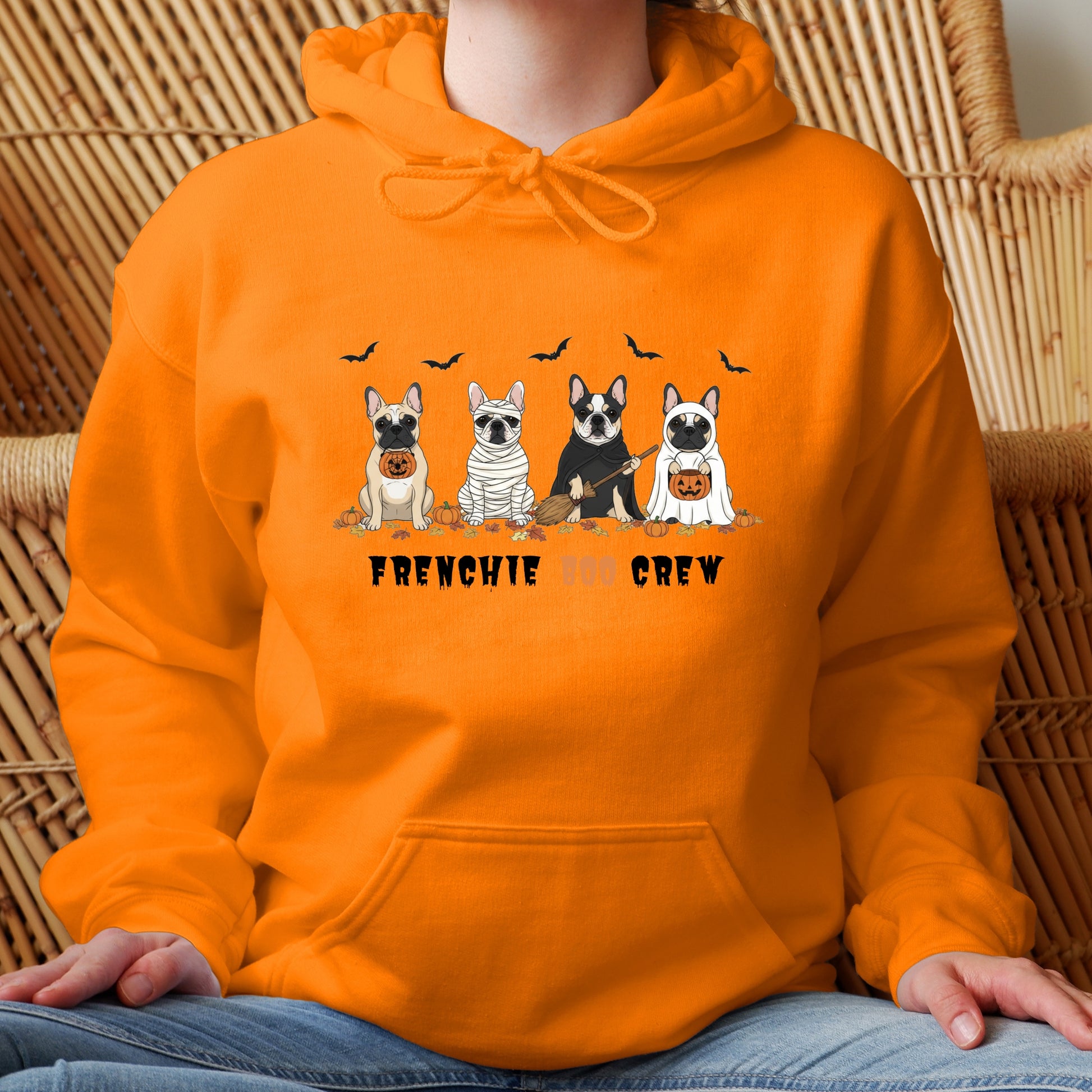 Halloween hoodie with four cartoon French Bulldogs in costumes, bats and pumpkins, and “Frenchie Boo Crew” text on white fabric.