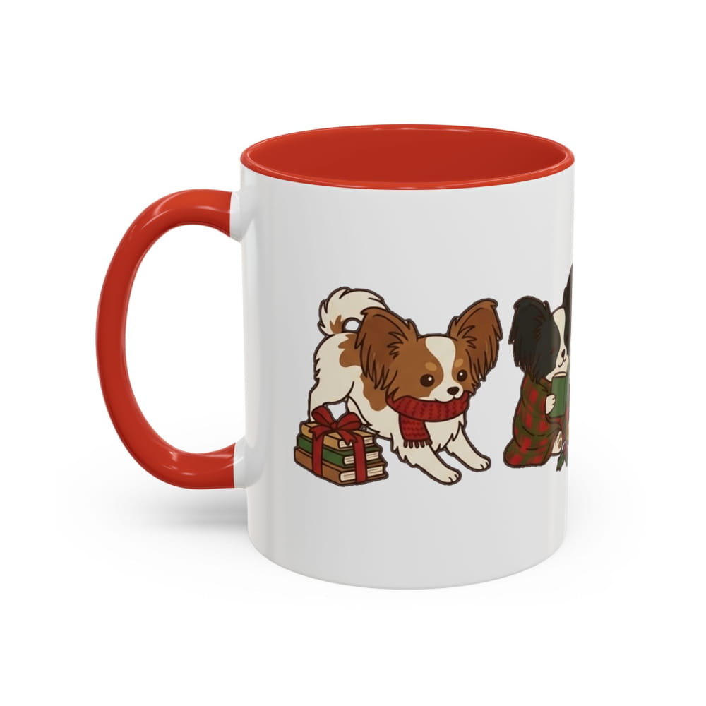 White ceramic mug with a red interior and red handle, showing a Papillon in a red scarf beside a wrapped gift and another Papillon in a plaid blanket.