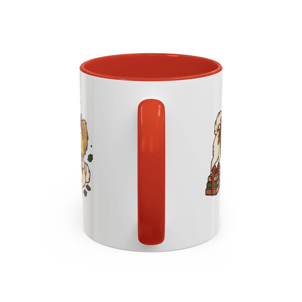 White ceramic mug with a red interior and red handle, back view with partial Papillon illustrations on either side of the handle.
