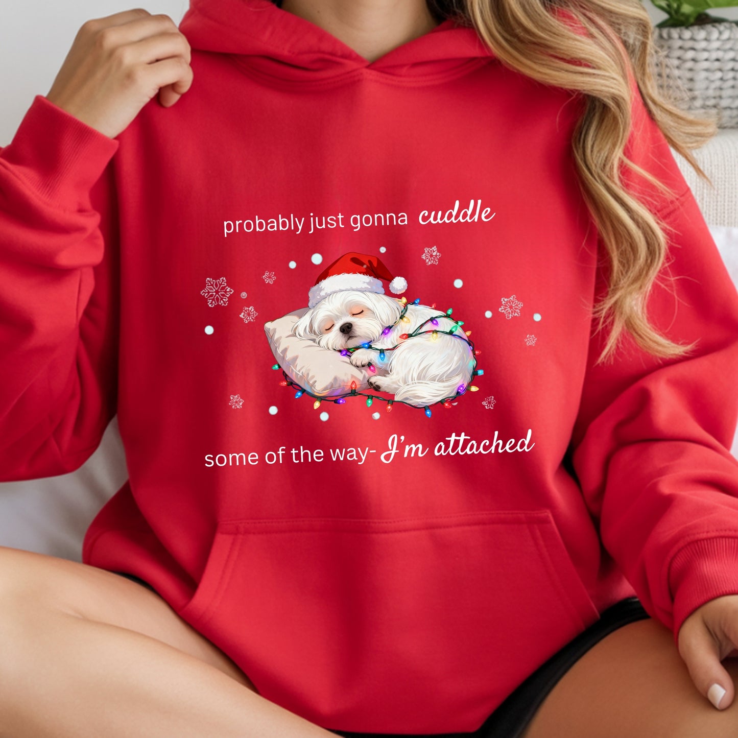Red hoodie with a Christmas-themed design featuring a dog in a Santa hat and text.