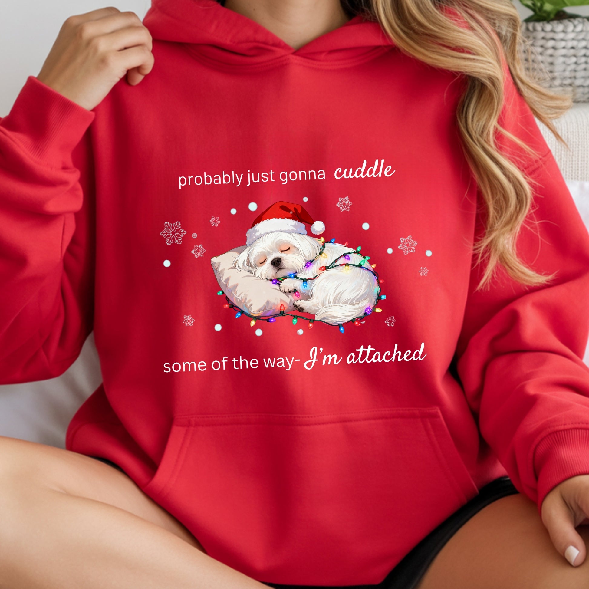Red hoodie with a Christmas-themed design featuring a dog in a Santa hat and text.