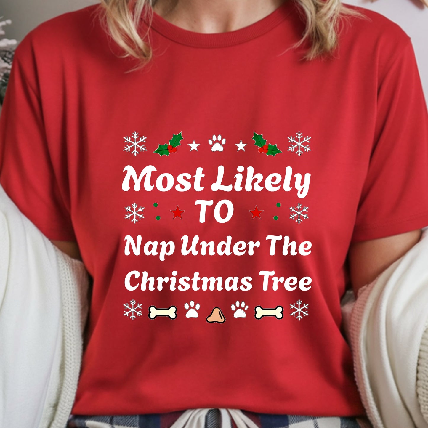 Red t-shirt with Christmas-themed text and graphics worn by a person.