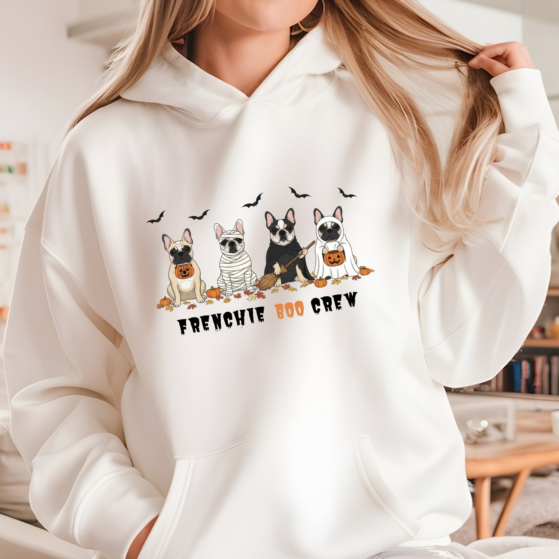 Halloween hoodie with four cartoon French Bulldogs in costumes, bats and pumpkins, and “Frenchie Boo Crew” text on white fabric.