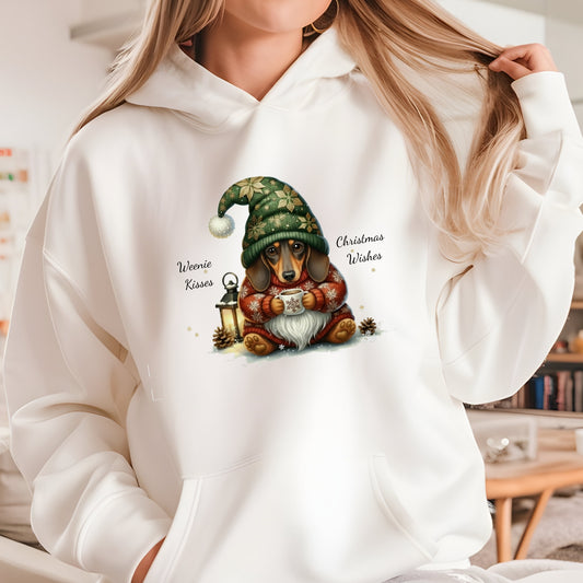 White hoodie with a Christmas-themed design featuring a dog and gnome, worn by a person.