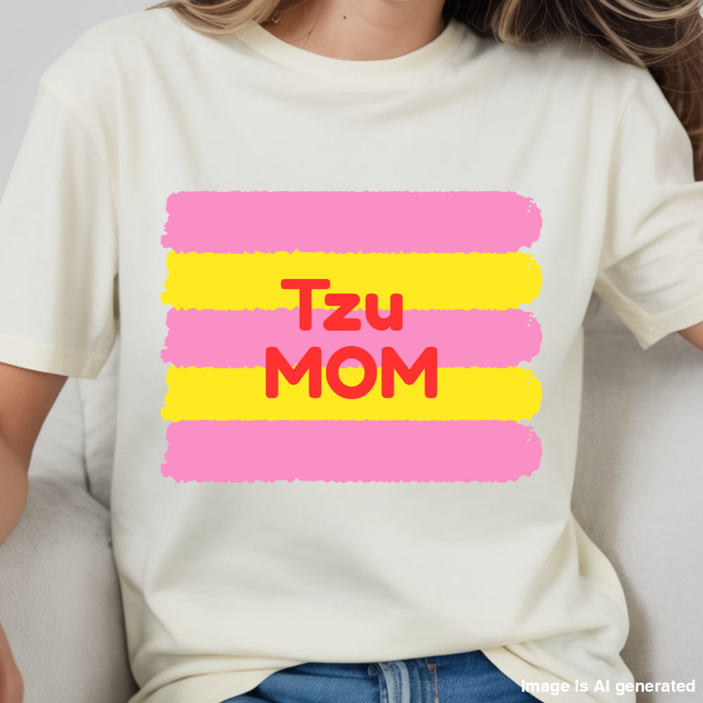 White t-shirt with 'Tzu Mom' text in red and pink stripes on a plain background