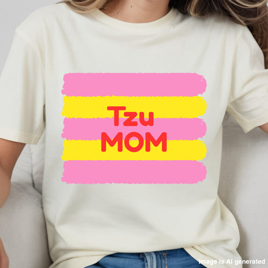 White t-shirt with 'Tzu Mom' text in red and pink stripes on a plain background