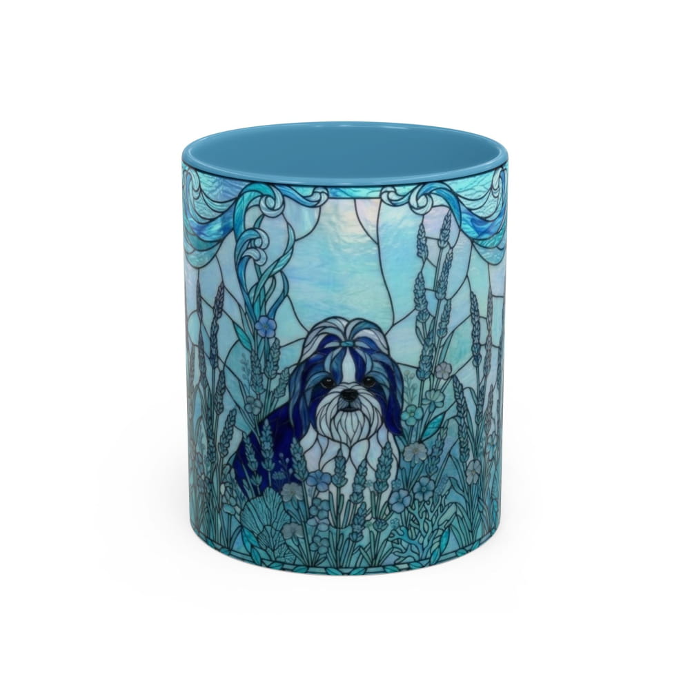 A ceramic mug featuring a blue and white stained-glass style illustration of a Shih Tzu dog surrounded by ornate floral and leafy designs, with a solid blue interior and rim.