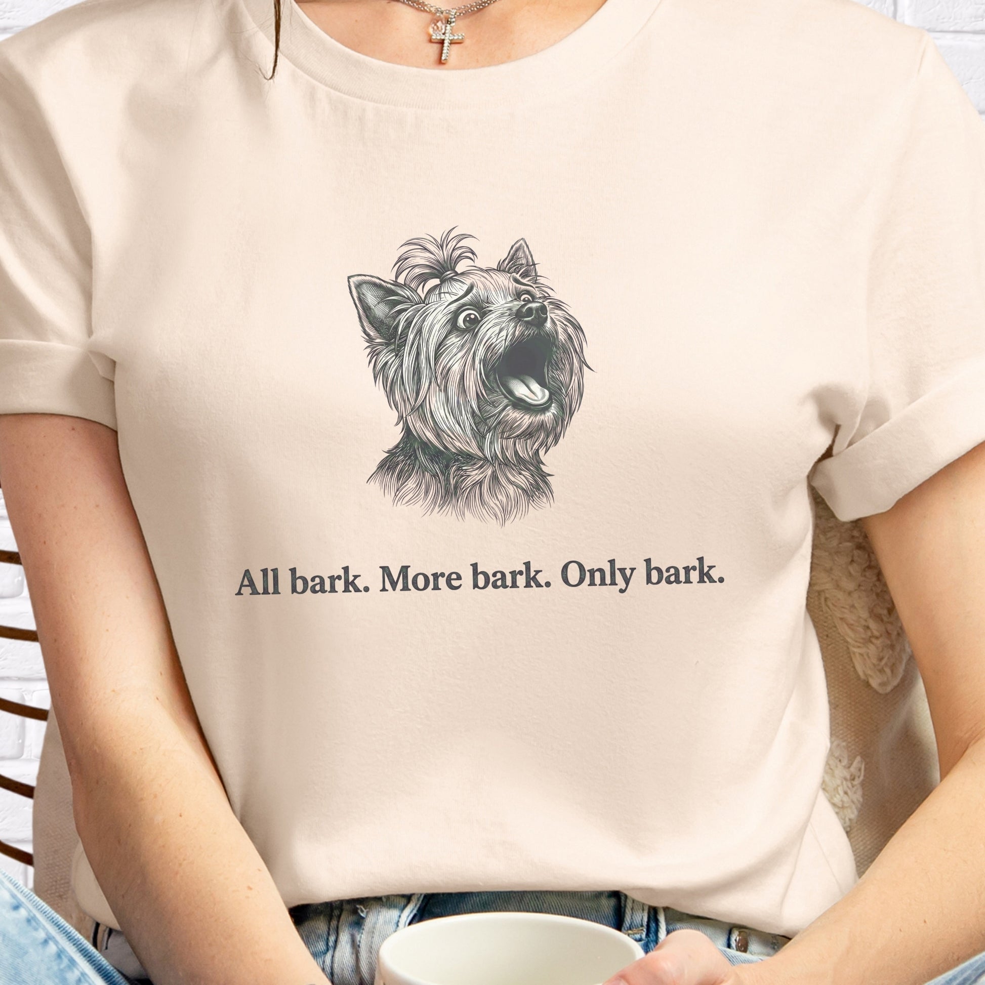 Person wearing a t-shirt with a dog graphic and text 'All bark. More bark. Only bark.'