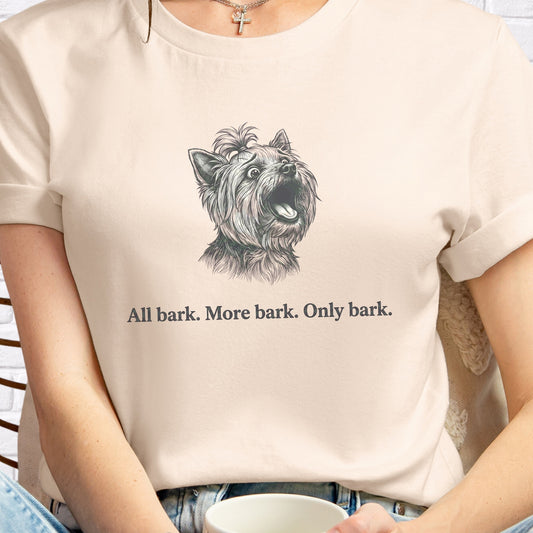 Person wearing a t-shirt with a dog graphic and text 'All bark. More bark. Only bark.'