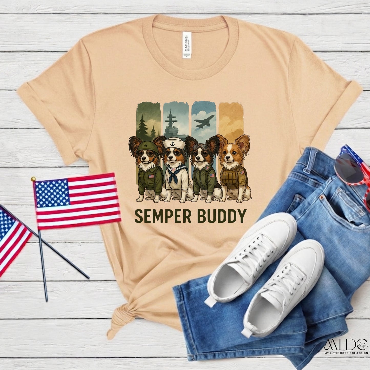 Beige t-shirt with dog graphic and 'Semper Buddy' text, paired with jeans and sneakers on a wooden surface.