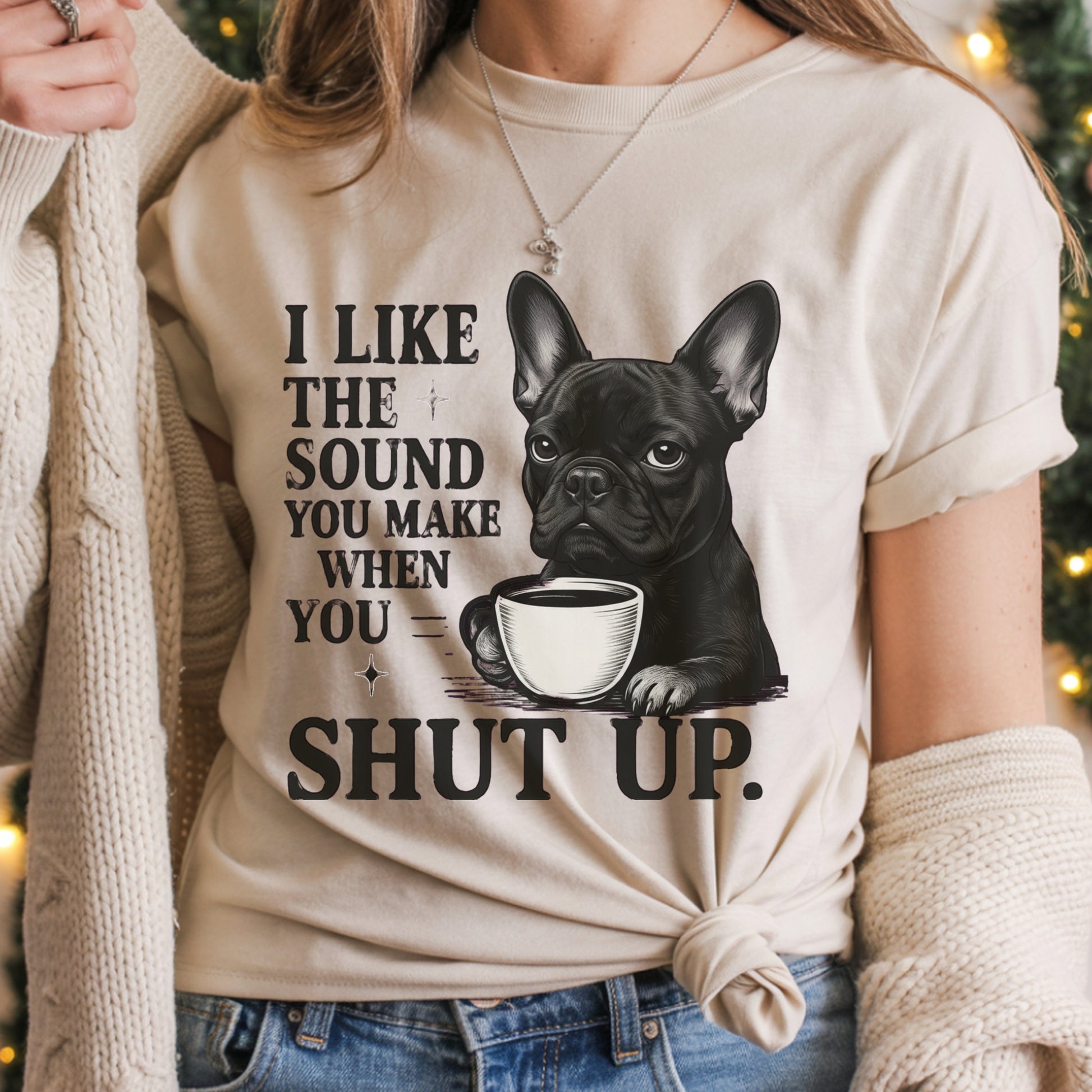 Person wearing a t-shirt with a dog and coffee cup graphic and text.