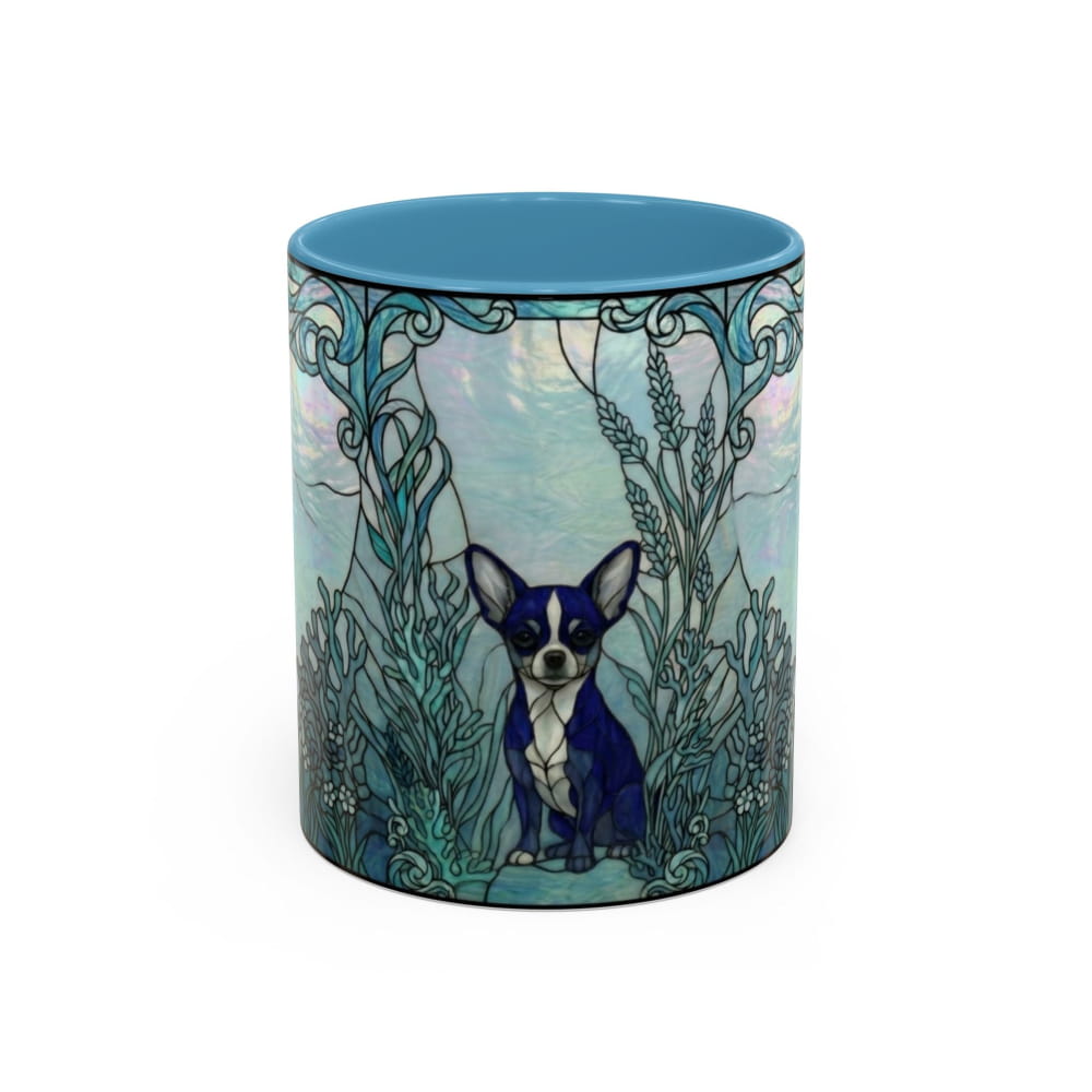 A ceramic mug featuring a blue and white Boston Terrier dog sitting in a teal and blue Art Nouveau style botanical design, with a solid blue interior, shown on a white background.