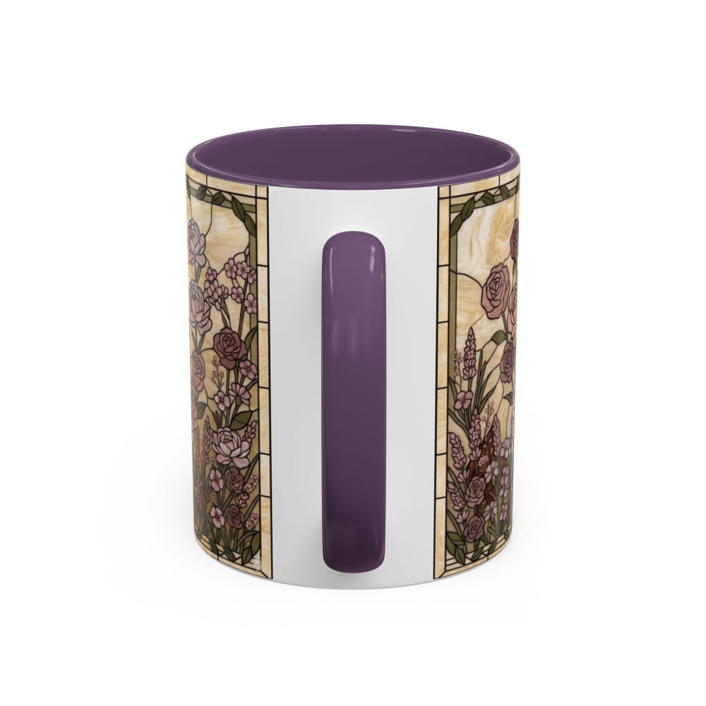A ceramic mug with a white exterior featuring a vintage stained-glass style floral pattern in purple, beige, and green, with a solid purple handle and matching purple interior, shown on a white background.