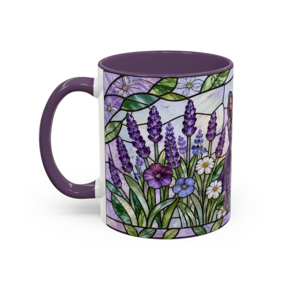 A ceramic mug with a purple handle and interior, featuring a stained-glass style floral design on the outside with purple lavender, green leaves, and white and purple flowers.
