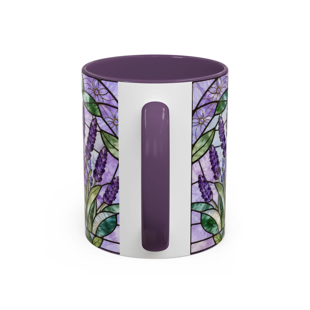 A ceramic mug featuring a purple and lavender stained-glass floral pattern with green leaves, a solid purple handle, and a solid purple interior, shown on a clean white background.
