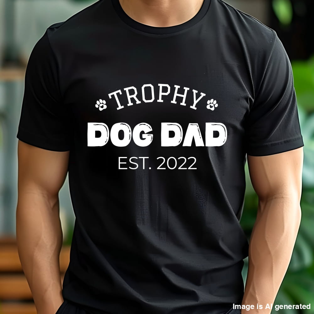 Black t-shirt with 'Trophy Dog Dad Est. 2022' text worn by a person.