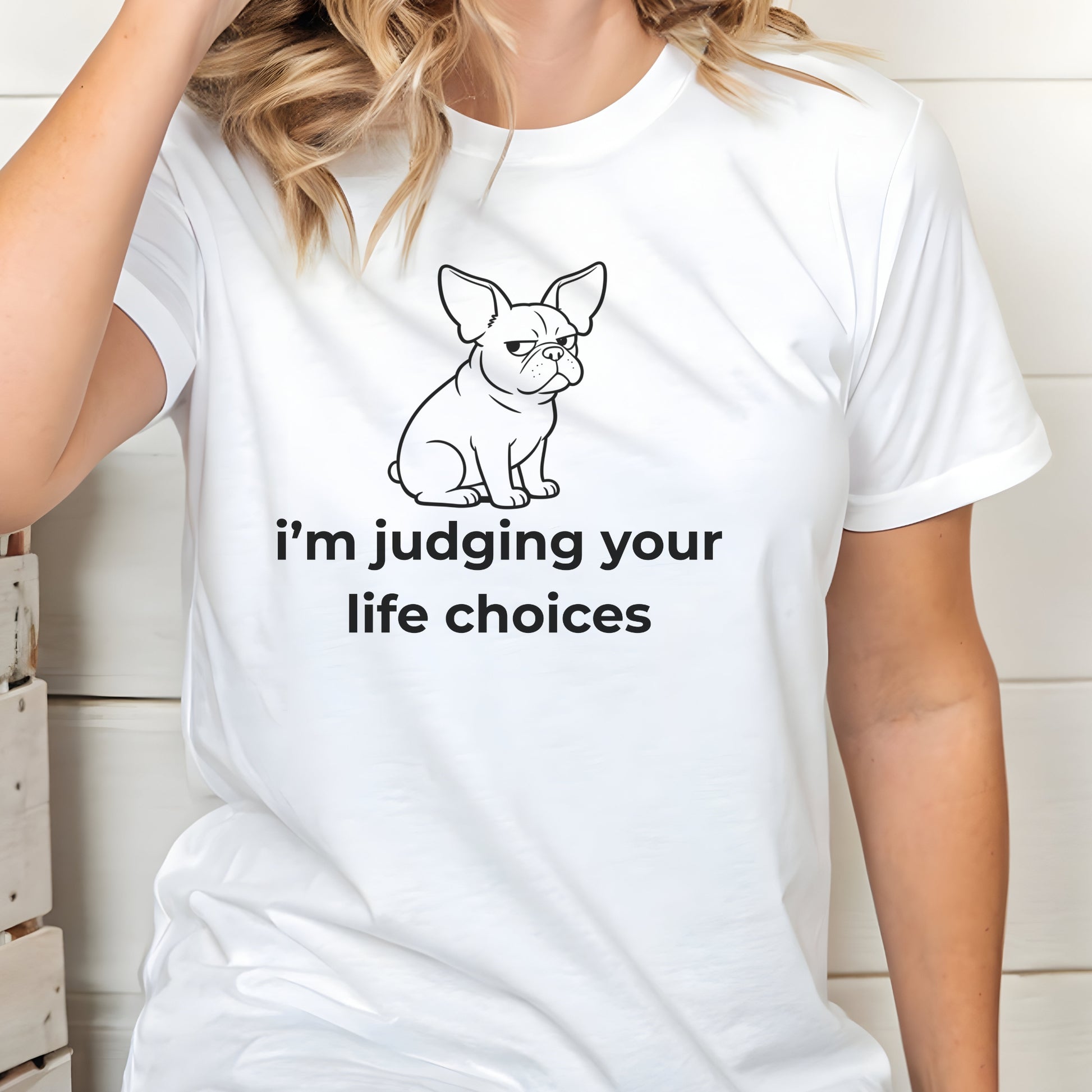 White t-shirt with a graphic of a dog and text 'i'm judging your life choices' worn by a person.