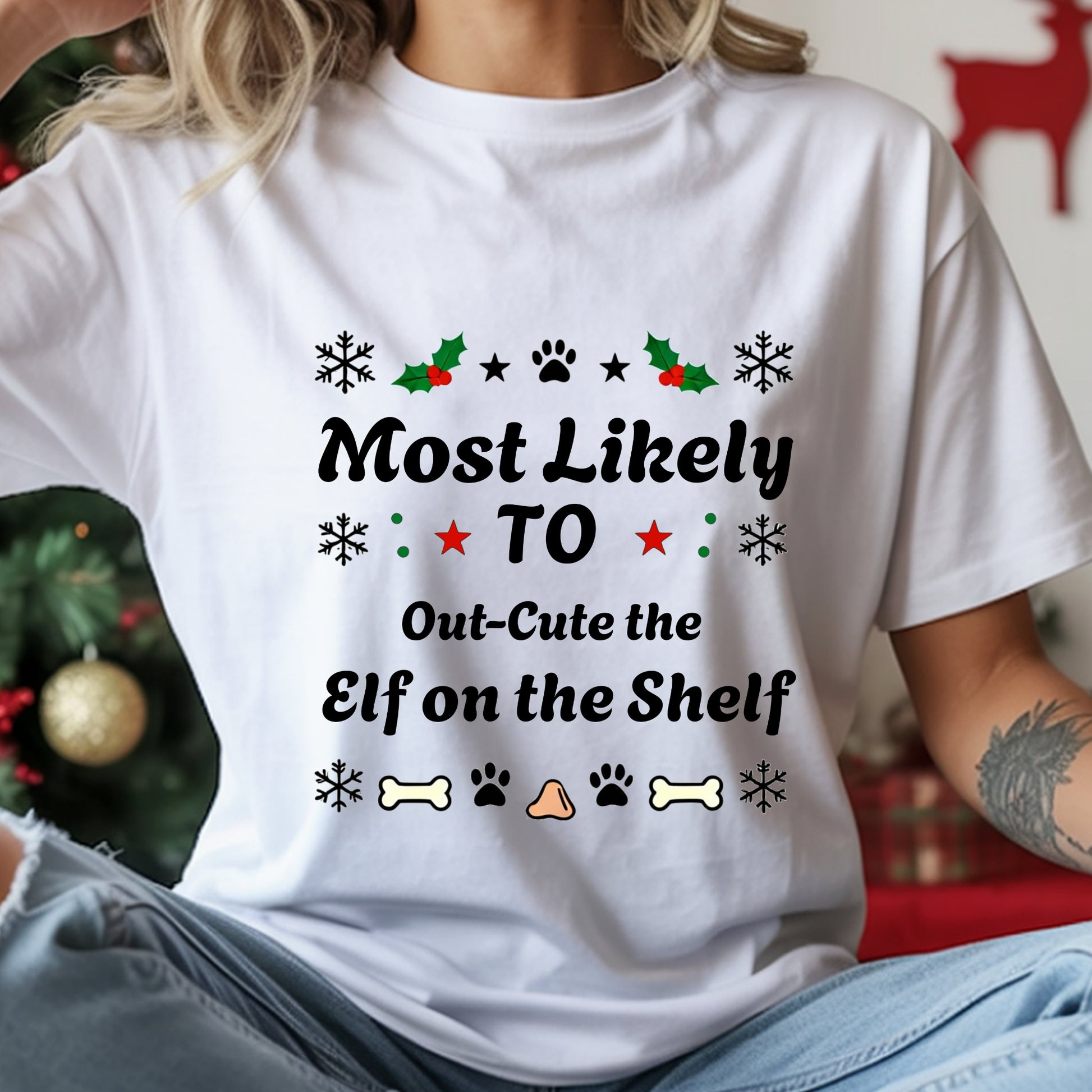 Person wearing a white t-shirt with Christmas-themed text and graphics.