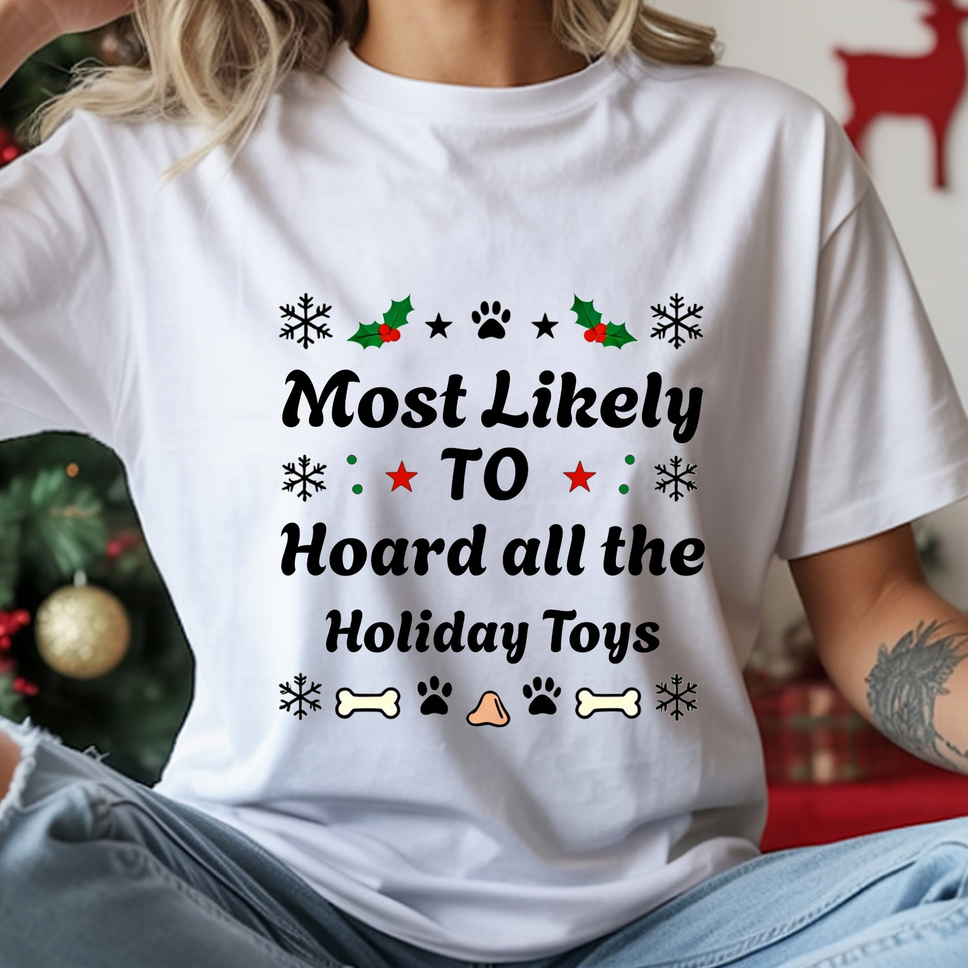Person wearing a white t-shirt with Christmas-themed text and graphics.