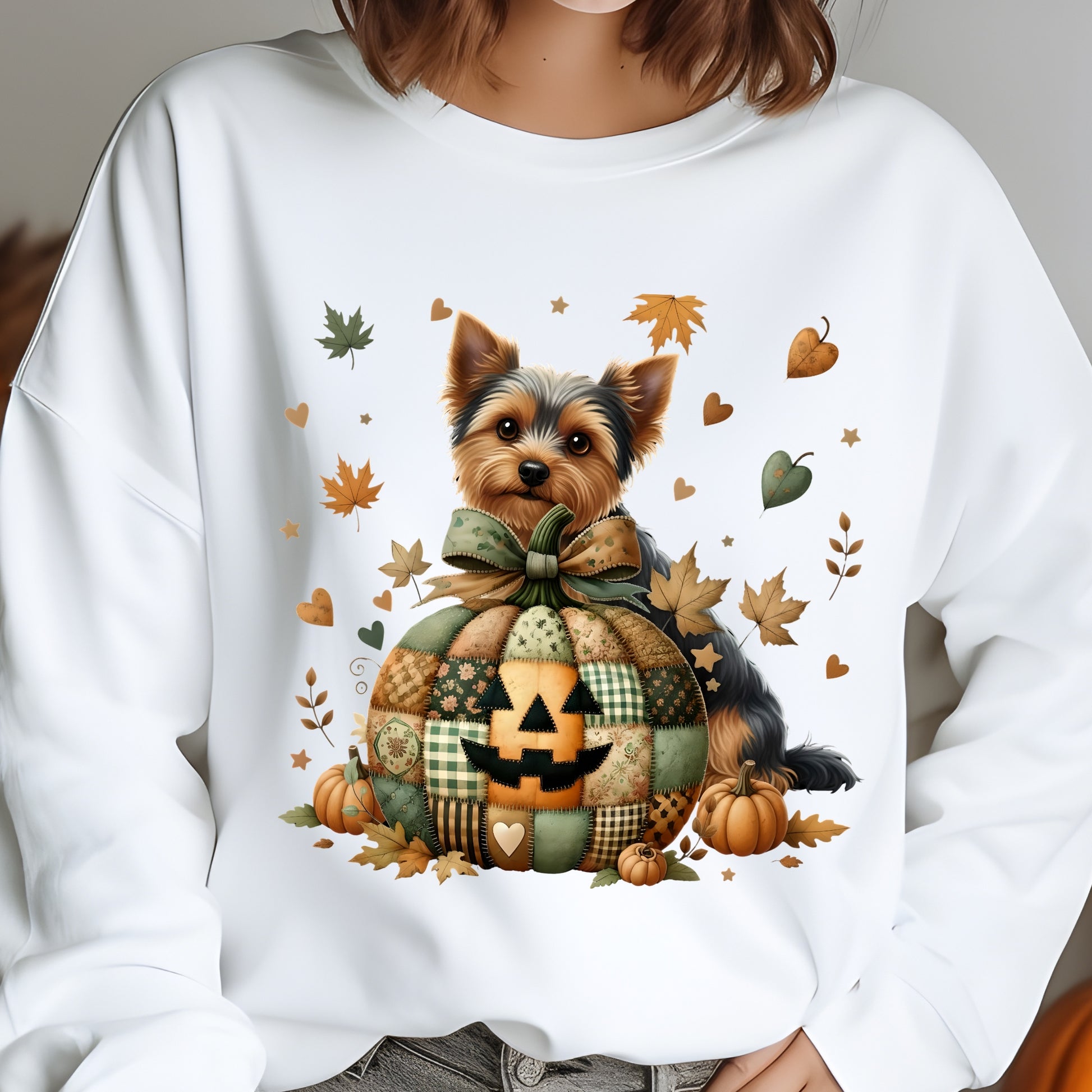 White sweatshirt with a dog in a pumpkin patch design on a gray background