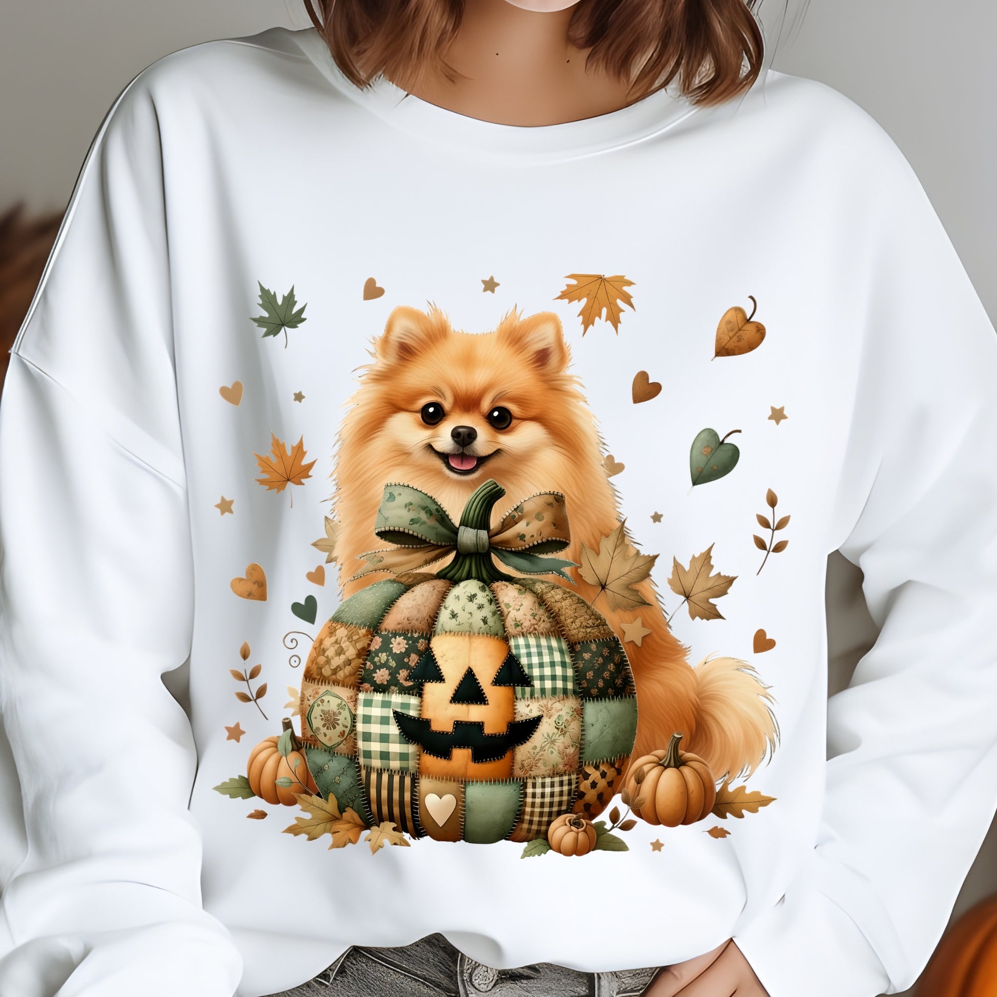 White sweatshirt with a Pomeranian dog design featuring pumpkins and leaves.