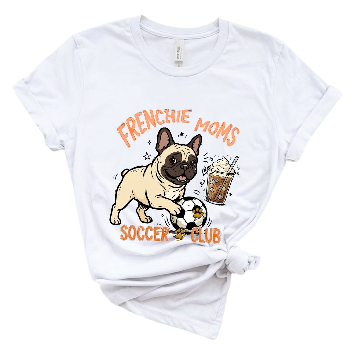 White t-shirt with a graphic of a pug, soccer ball, and iced coffee, with text 'FRENCHIE MOMS SOCCER CLUB' on a white background.