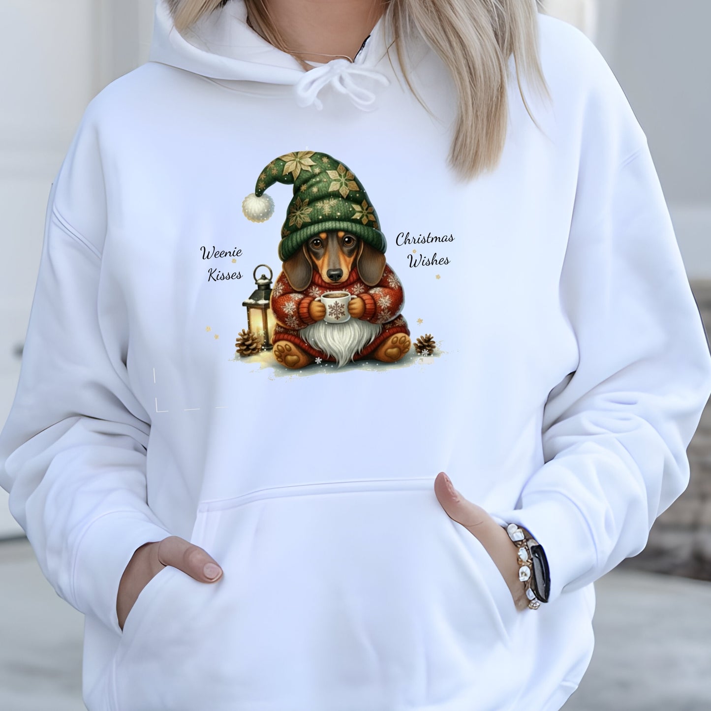 White hoodie with a Christmas-themed design of a dog wearing a gnome hat and holding a mug.