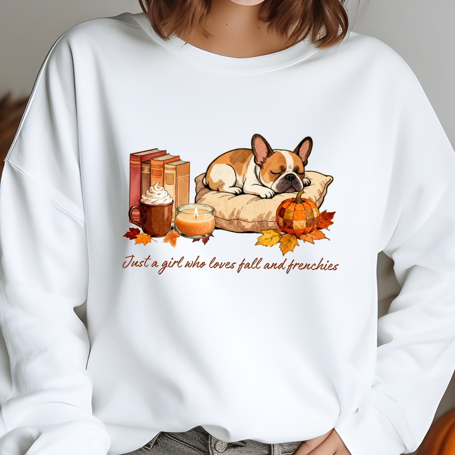 White sweatshirt with a dog, books, pumpkin, and fall-themed design on a gray background