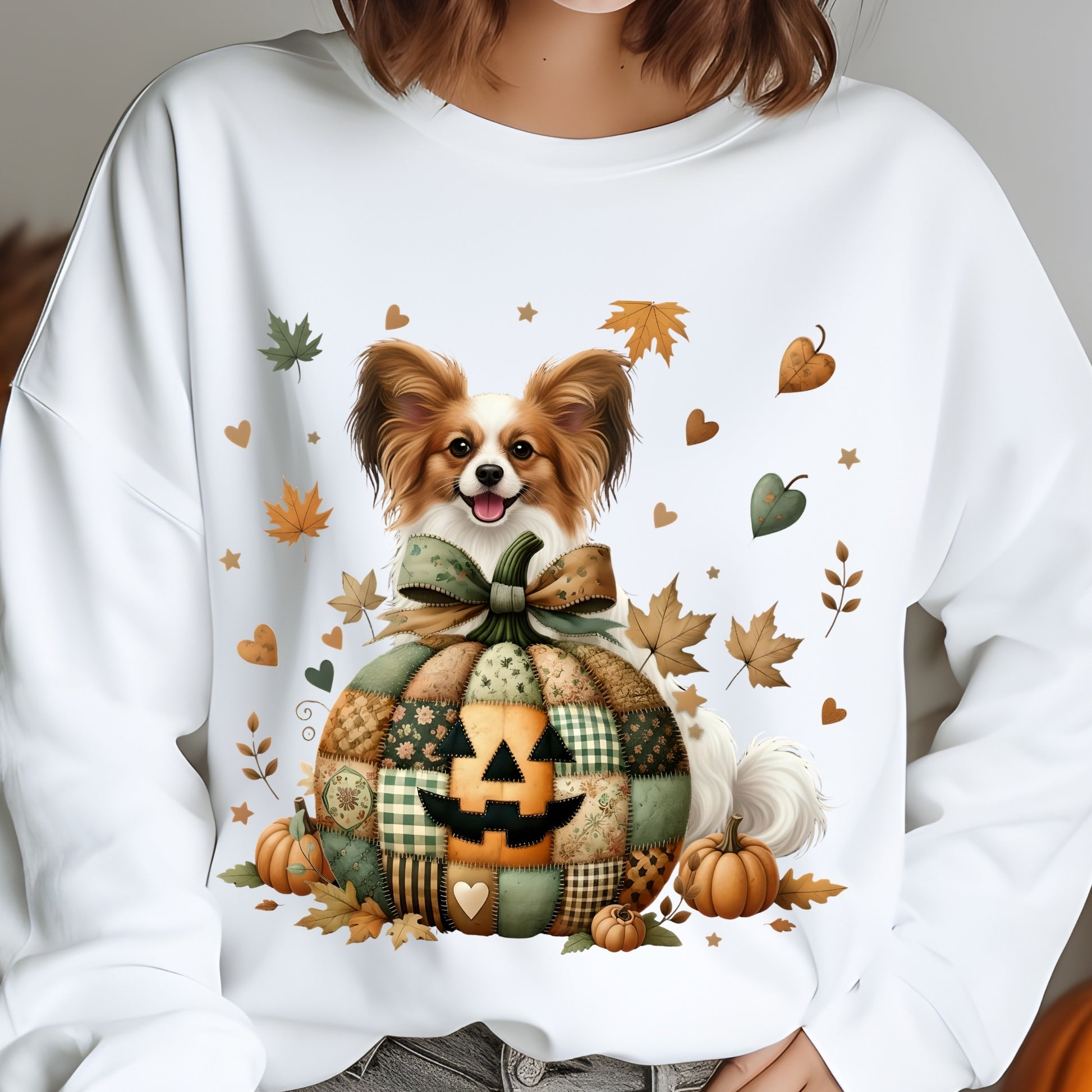 White sweatshirt with a dog and pumpkin design, featuring autumn leaves and pumpkins.
