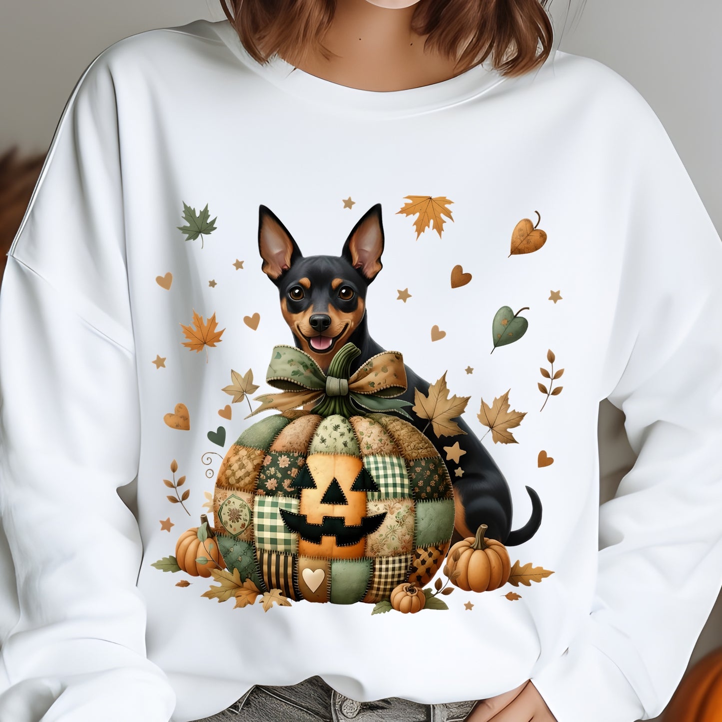 White sweatshirt with a dog and pumpkin design, featuring autumn leaves and pumpkins.