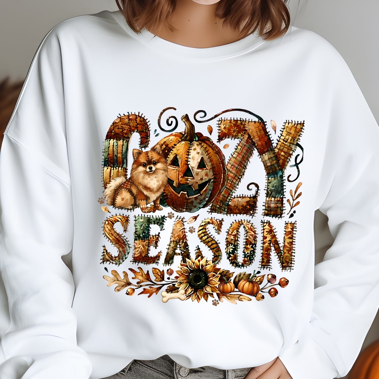 White sweatshirt with Halloween-themed design featuring a pumpkin, fox, and text on a plain background.