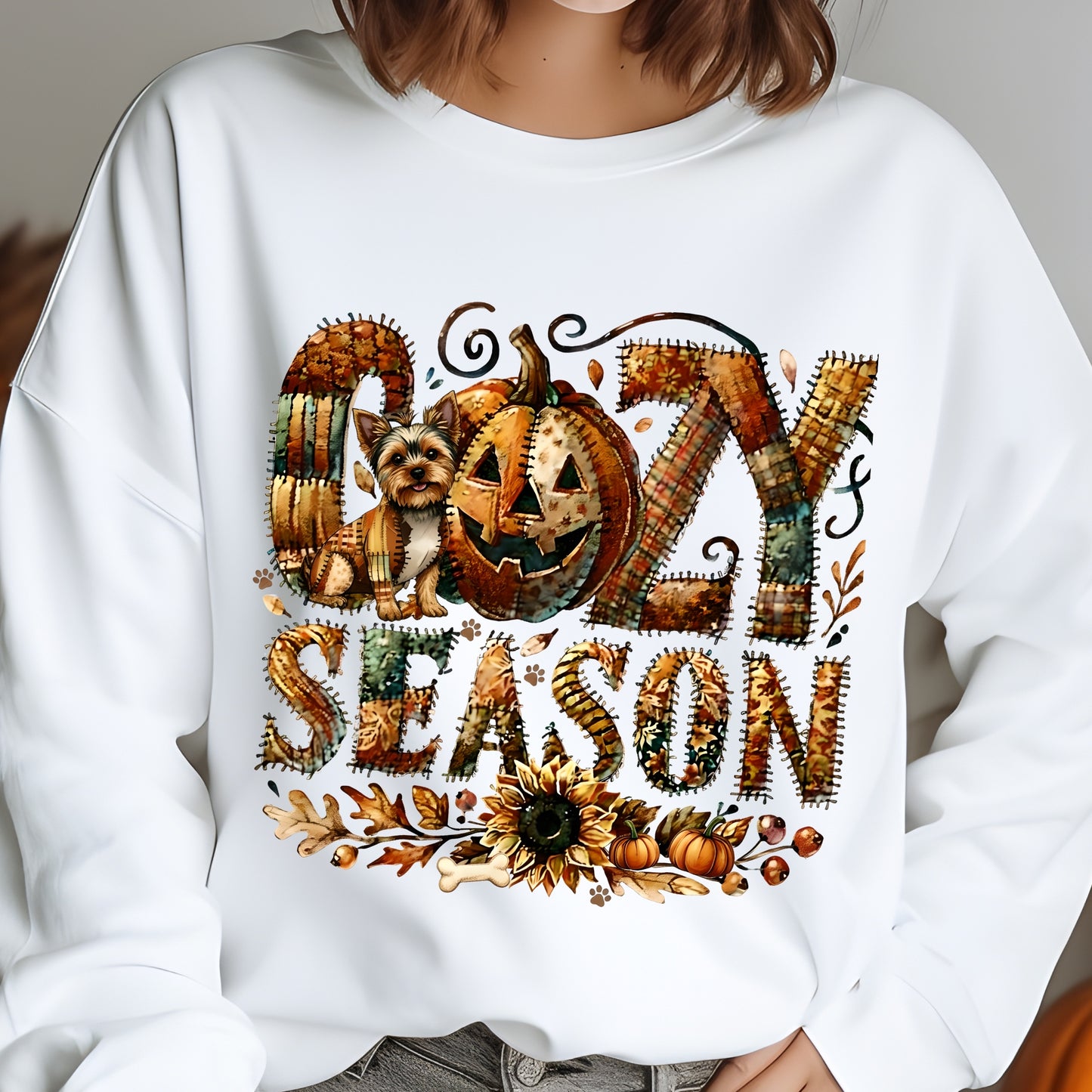 White sweatshirt with ' cozy season' design featuring a pumpkin and dog.