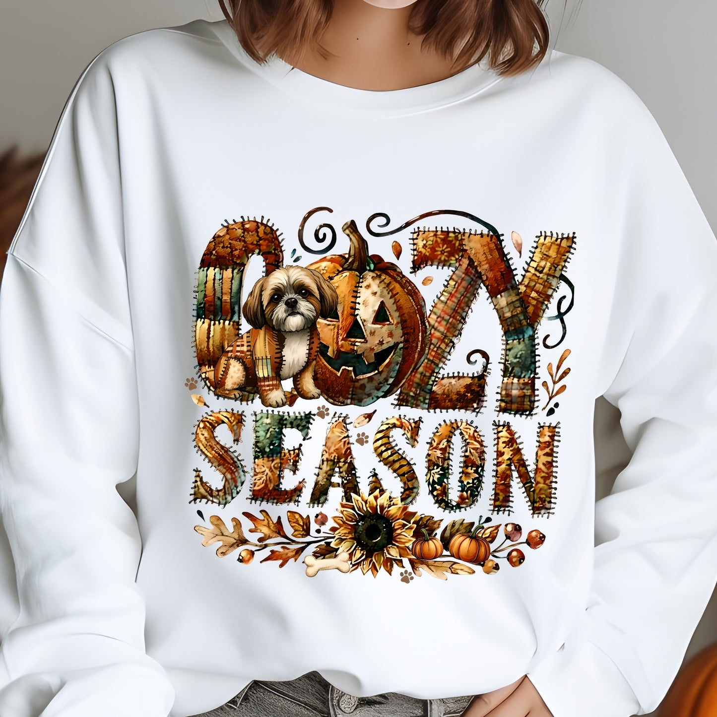 White sweatshirt with Halloween-themed design featuring a dog, pumpkin, and text on a plain background.