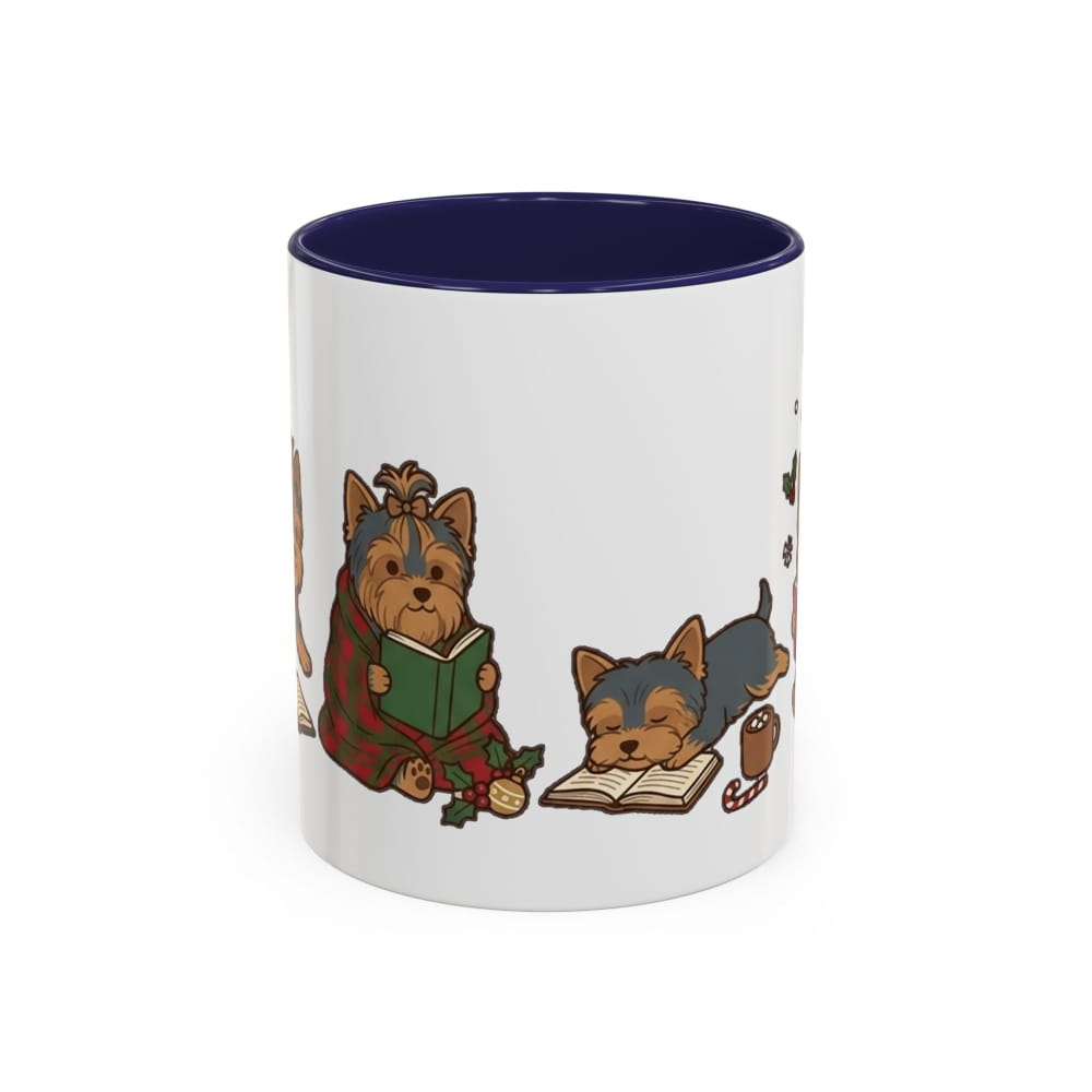 A white ceramic mug with a dark navy blue interior, featuring a cartoon illustration of two small Yorkshire Terrier dogs reading books on the side.