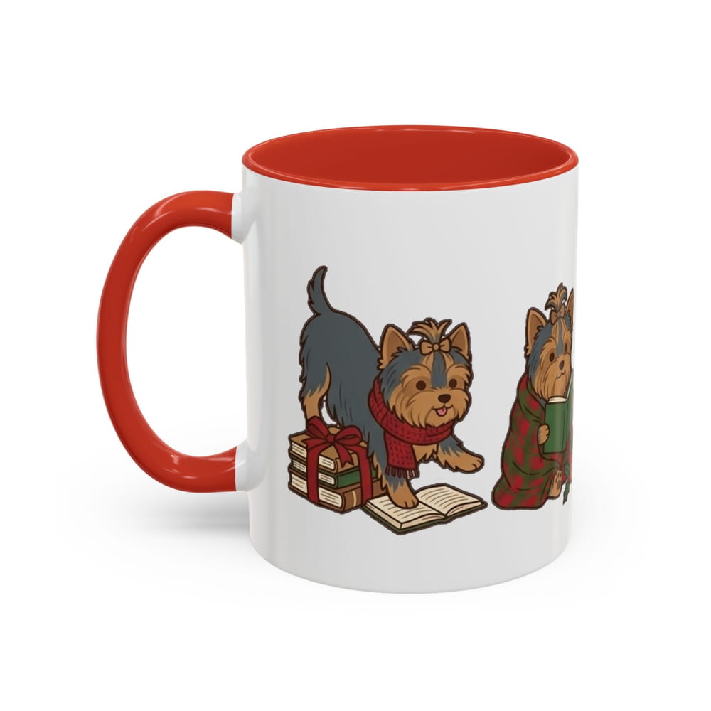 White ceramic mug with a red interior and red handle, showing a Yorkie in a red scarf beside wrapped gifts and an open book, and another Yorkie in a plaid blanket.
